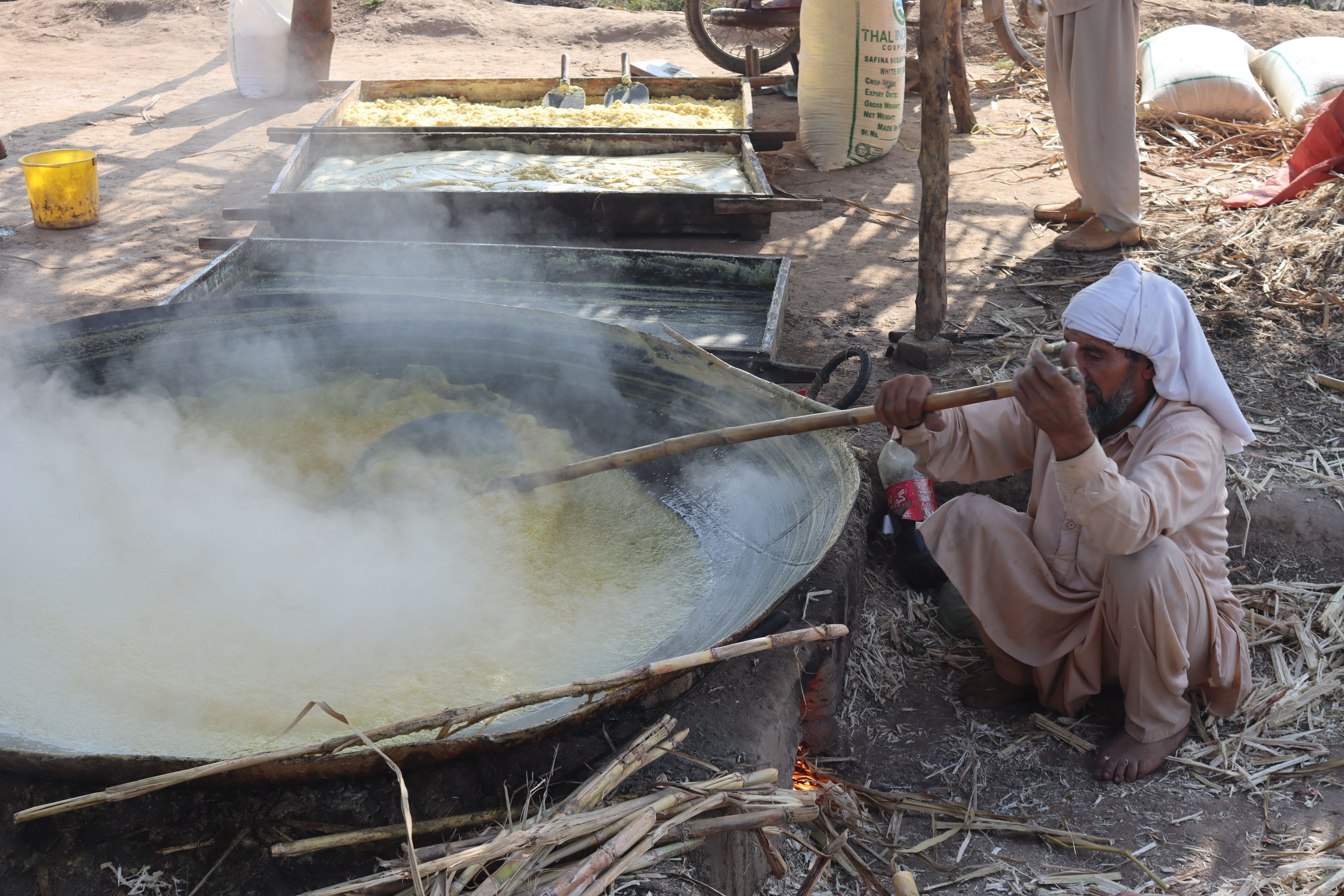 Sugarcane juice boiling down to jaggery