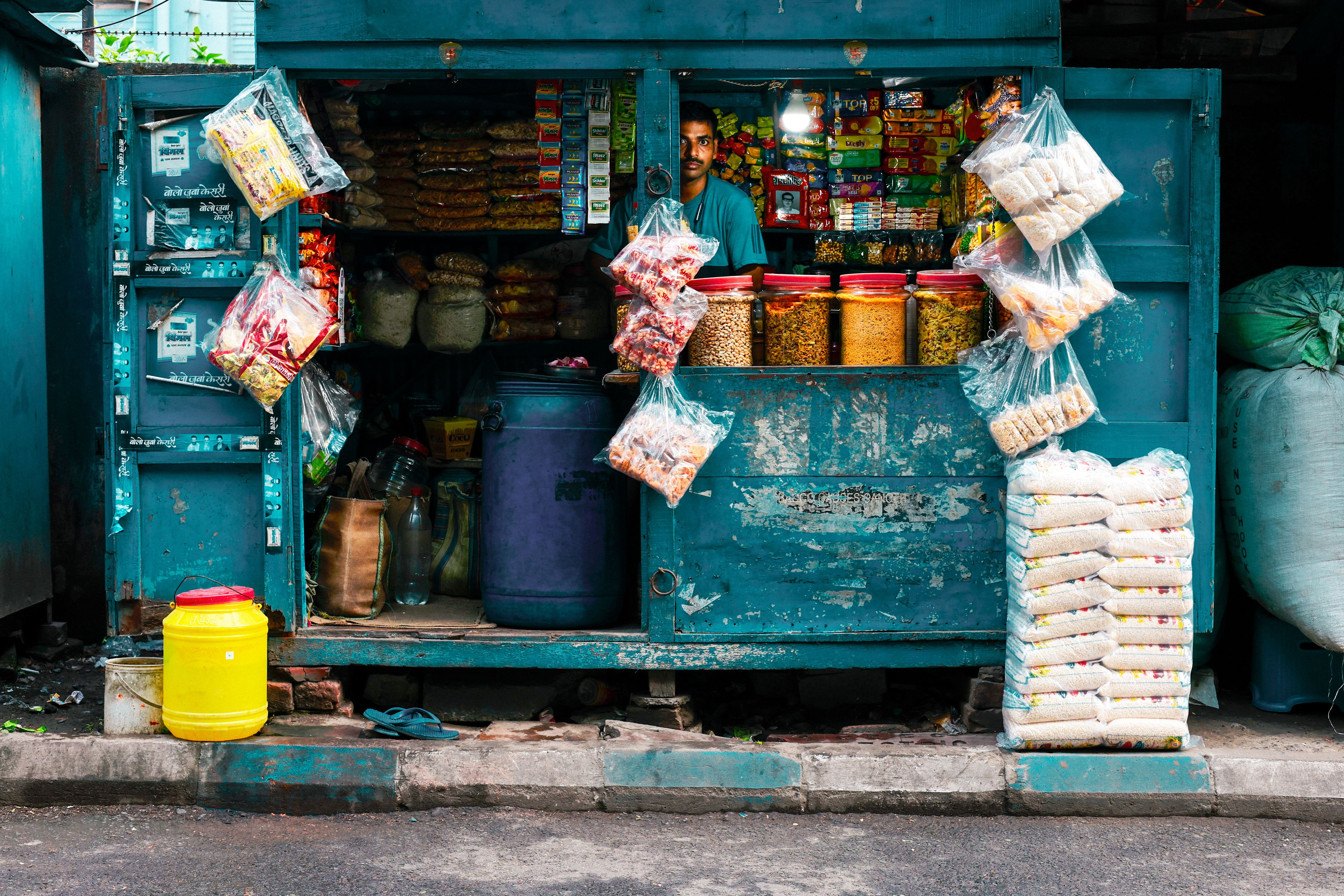 A small city kiosk shop stocked with packaged food