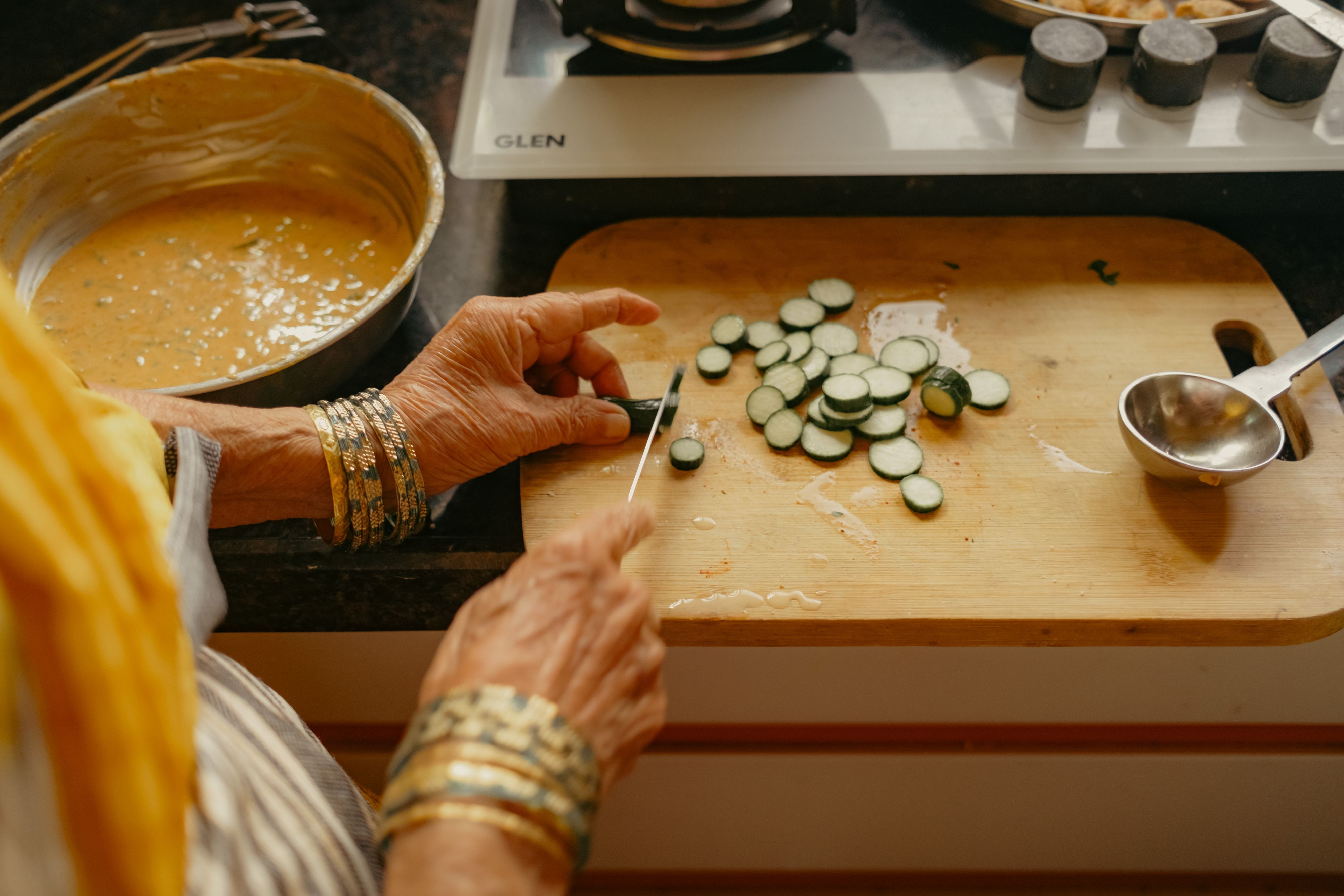Hands preparing food in a kitchen