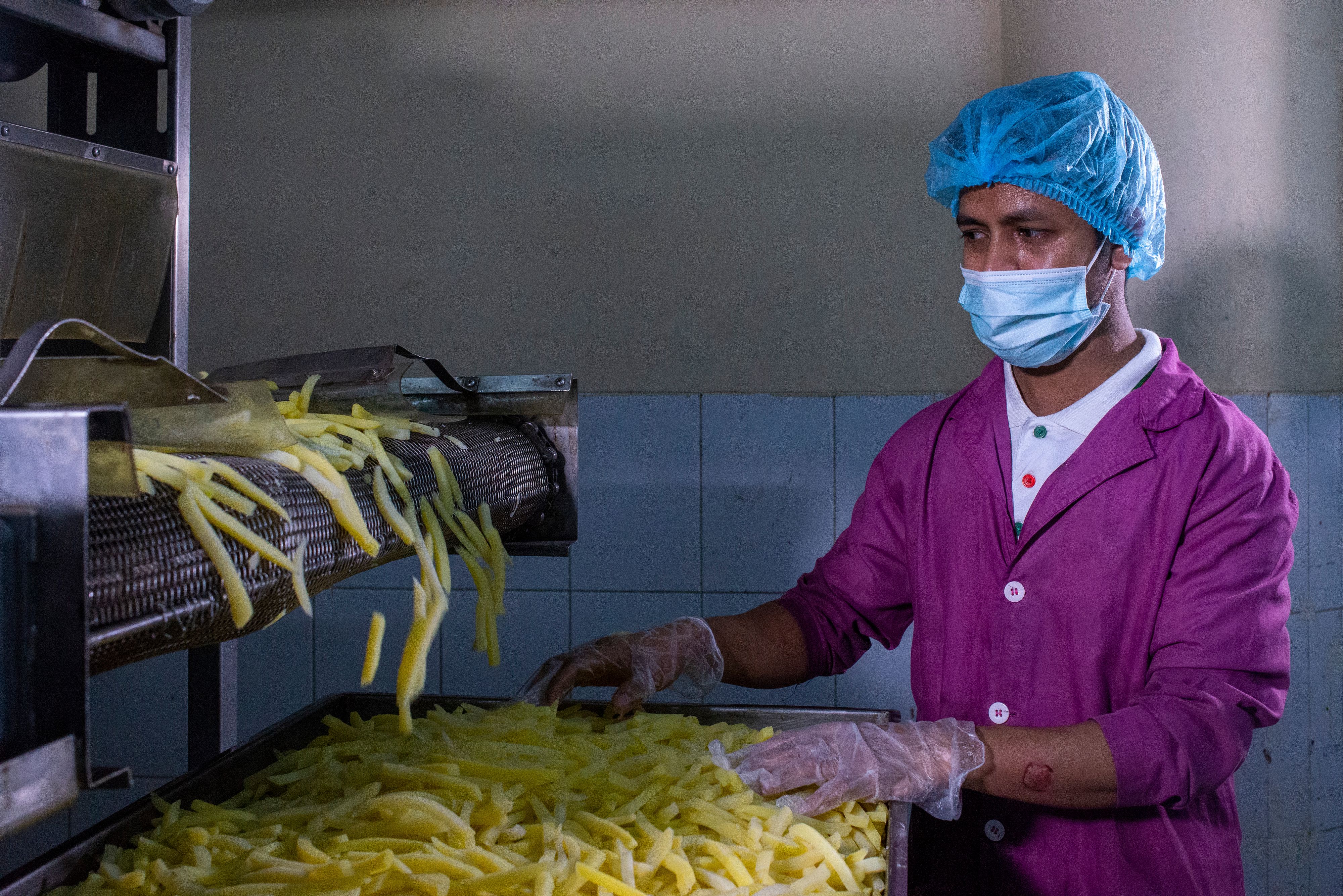 A worker on a food production line